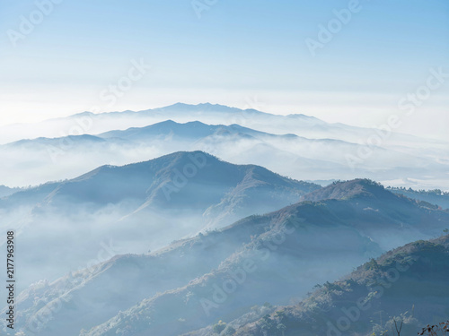 Misty mountains with clouds in the valleys