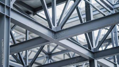 Structural steel beams forming a robust metal framework in a modern building. Perfect for architecture and industrial engineering development concepts.
