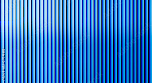 Quadro su tela Vertical blue metal ribbed texture with alternating light and shadow