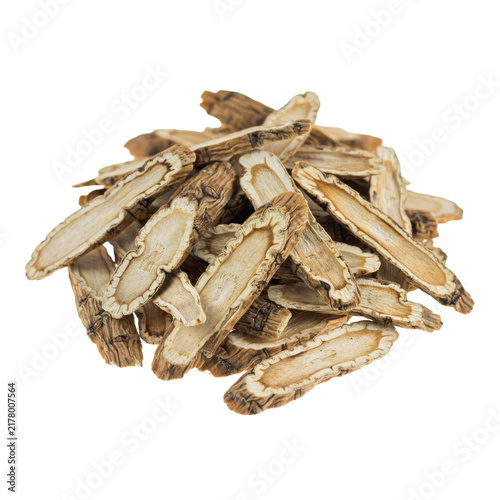 A pile of dried sliced ginseng roots used for traditional herbal medicine and dietary health supplements isolated on a transparent background