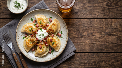 Polish dumplings dish: Pierogi on a table seen from above with copy space, ad image traditional East European food