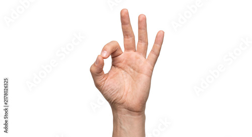 Konstfotografi Close-up of a hand forming the OK gesture with fingers against a white backgroun