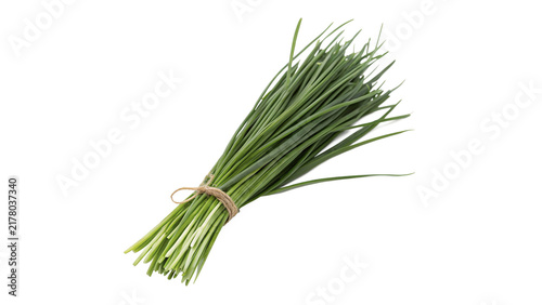Quadro su tela Bunch of fresh green chives tied with string isolated on black background for cu