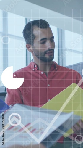 Business team analyzing charts and graphs with data processing animation overlay