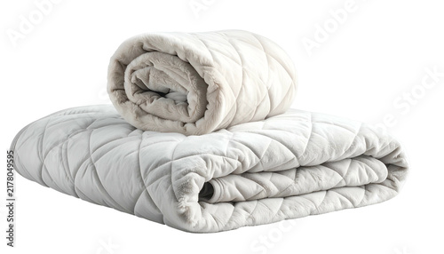 Padded, folded bedcover with rolled blanket on top, neutral colors