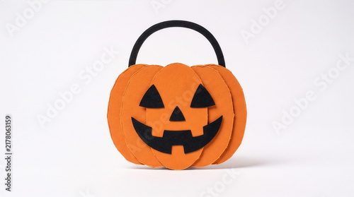 Orange and black cardboard Halloween pumpkin candy bucket