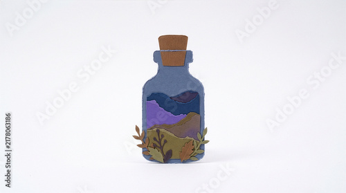 Colorful layered cardboard potion vial for Halloween witchcraft designs