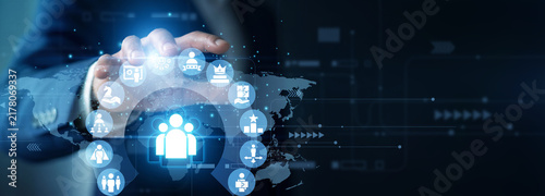 Managing director holding structure graph of Leadership. Corporate executive analyzing team dynamics and management growth chart on hologram screen. Strategic corporate business strategy.