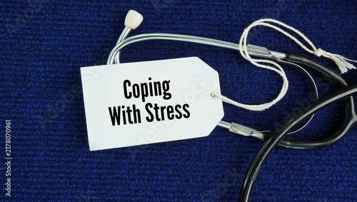 Cuadro en lienzo Stethoscope and paper tag with the words Coping with stress: You bounce back from setbacks and adapt to unexpected changes without falling apart