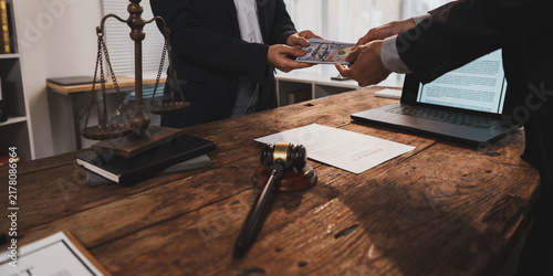 Obraz na plátně Businessmen exchanging money, representing bribery and corruption in legal syste