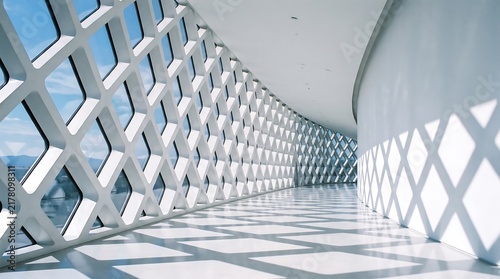Modern white architectural corridor with diamond patterned lattice and sunny reflections architecture corridor interior