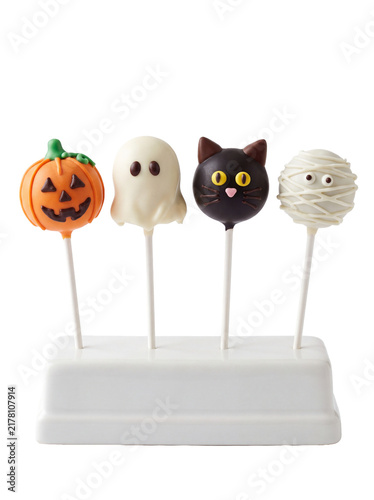 Assorted Halloween Cake Pops with Pumpkin Ghost Black Cat and Mummy Designs on White Stand Isolated