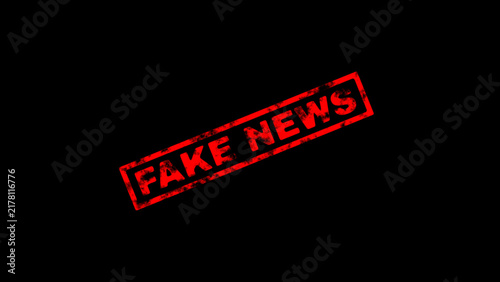 Fotografía Red fake news rubber stamp mark on black background