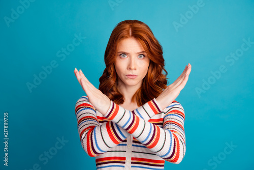 Cuadro en lienzo Redheaded woman crossing her arms in an X stop gesture showing refusal, disagree