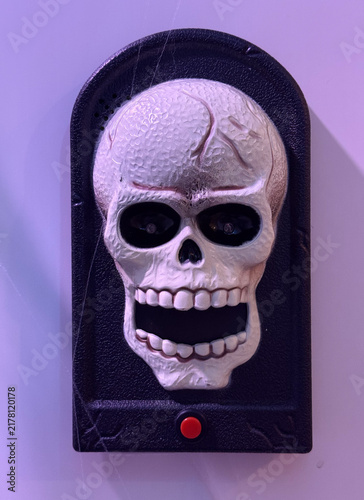 gazing skull decoration on purple wall, empty space for text concept of halloween, party