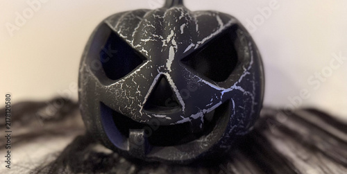 spooky halloween pumpkin on dark surface, copyspace, concept of halloween, party, decor