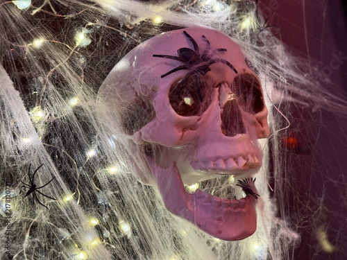 halloween skull with spiderwebs and lights banner concept of party, event, retail