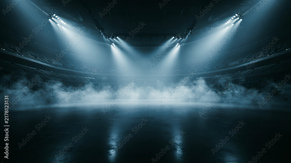 Obraz premium Empty stadium arena with dramatic spotlights and fog on the floor, perfect for sports events, concerts, or product launches