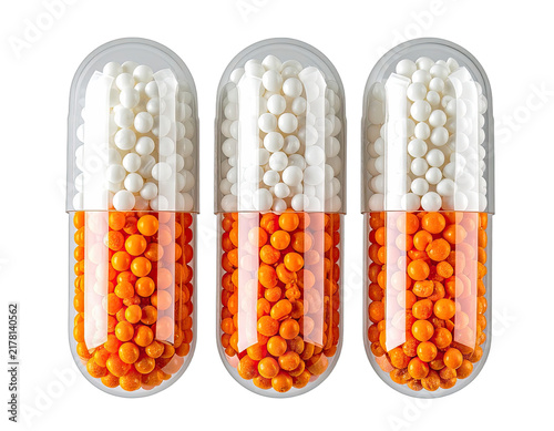 Three pharmaceutical capsules filled with white and orange pellets against a black background.