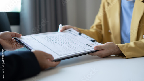 Bild auf Leinwand Business people hold a resume and talk to job applicants for job interviews about careers and Their personal history in the company