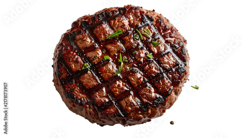 A juicy, grilled beef patty with grill marks and herbs sits on a black background.