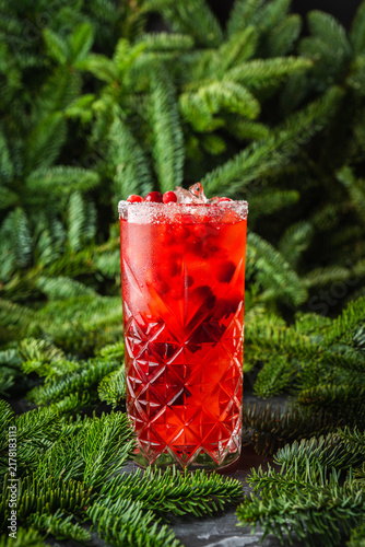 Tasty christmas cocktail with cranberry and foxberry. Shallow depth of field. Selective focus.