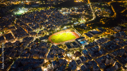 Aerial view of football stadium in the city at night