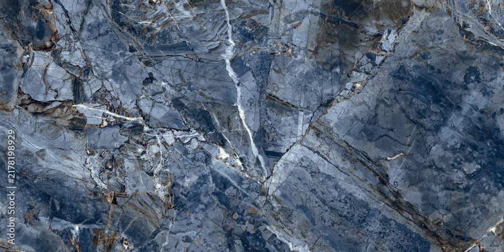 Obraz premium Elegant blue marble texture with soft natural veins and warm earthy tones, perfect for luxury interiors, ceramic tiles, and decorative backgrounds. 