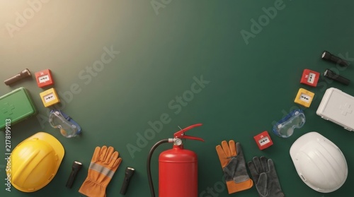 Safety equipment and fire extinguisher on a dark green background