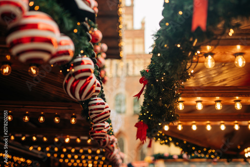 Christmas decorations on houses at the Christmas market in Wroclaw, Poland. View of garlands, ornaments and fir branches