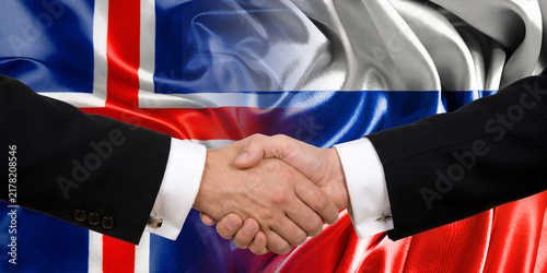 Foto Handshake between Russia and Iceland, international friendship, background with flags