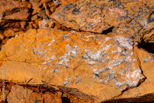 фотографія A beautiful orange rock pattern close-up
