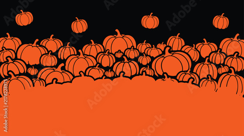 A festive halloween background featuring a dense collection of orange pumpkins arranged against a dark backdrop for seasonal holiday party invitation designs