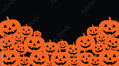 A festive collection of carved jack o lanterns creating a spooky halloween background with copy space for your seasonal holiday text designs