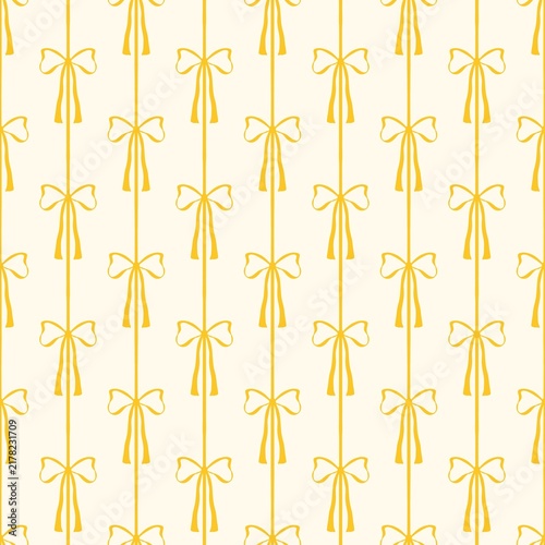 Yellow bow pattern on white background, seamless festive ribbon wallpaper design.