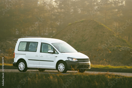 Fotografie Passenger minivan on busy asphalt road