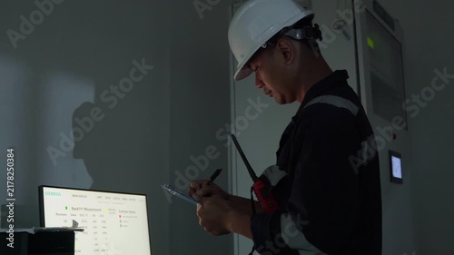 Footage engineer using computer check analysis continuous emissions monitoring system for air pollution reduction. Sustainable environment technology data information Concept energy saving, control 