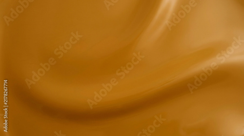 Blurry close-up of a textured surface with warm tones