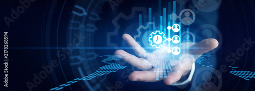 Obraz na płótnie System admin shown by configuring complex cloud ERP software on dual monitors to integrate corporate supply chain and finance data