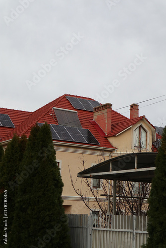 Solar panels on a house roof in a residential area.