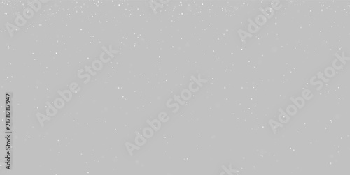 White snowflakes fall densely against a completely black backdrop. The snow varies in size and appears softly blurred in some areas. This scene is perfect for winter, cold, or.