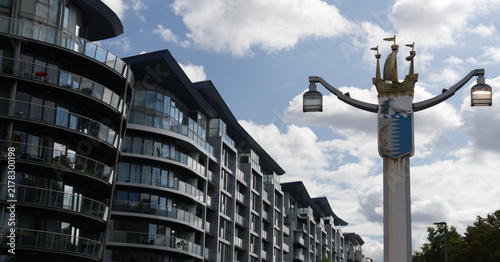Photography Contemporary residential architecture featuring curved glass balconies and modern design along the River Thames waterfront in London, England