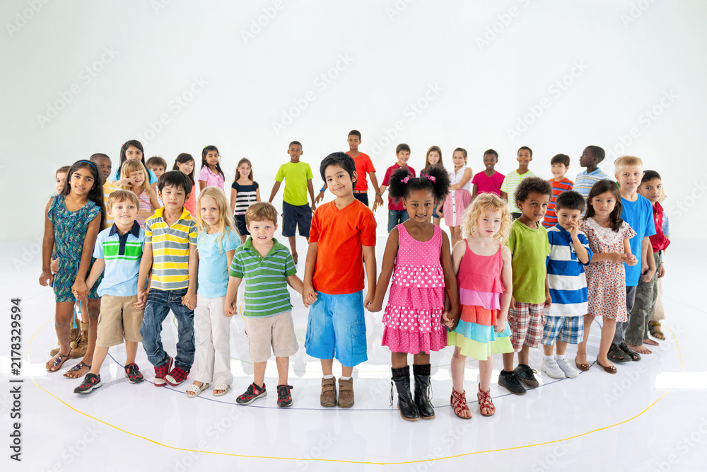 Fototapeta premium Diverse children standing together joyfully
