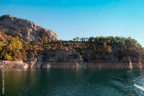 Scenic mountain lake at Green Canyon, Turkey, under a clear blue summer sky