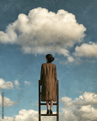 Businesswoman Climbing a Ladder Toward the Clouds