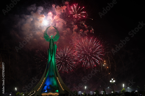 Spectacular colorful fireworks illuminating the Humo Bird Stella in Yangi Uzbekistan, Tashkent, Uzbekistan, at night. Dramatic festive scene featuring the iconic national symbol against a vibrant illu