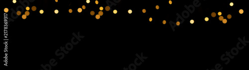 Glowing overlay banner panorama texture - hanging defocused fairy lights bokeh lights, isolated on black background	
