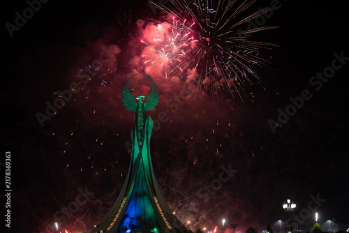 Spectacular colorful fireworks illuminating the Humo Bird Stella in Yangi Uzbekistan, Tashkent, Uzbekistan, at night. Dramatic festive scene featuring the iconic national symbol against a vibrant illu