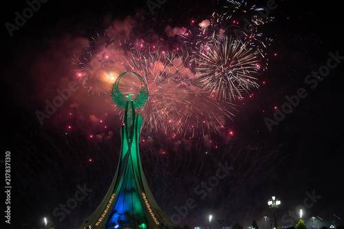 Spectacular colorful fireworks illuminating the Humo Bird Stella in Yangi Uzbekistan, Tashkent, Uzbekistan, at night. Dramatic festive scene featuring the iconic national symbol against a vibrant illu