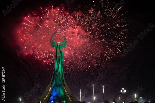 Spectacular colorful fireworks illuminating the Humo Bird Stella in Yangi Uzbekistan, Tashkent, Uzbekistan, at night. Dramatic festive scene featuring the iconic national symbol against a vibrant illu